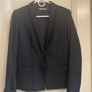 T Tahari navy pinstriped blazer with black trim.